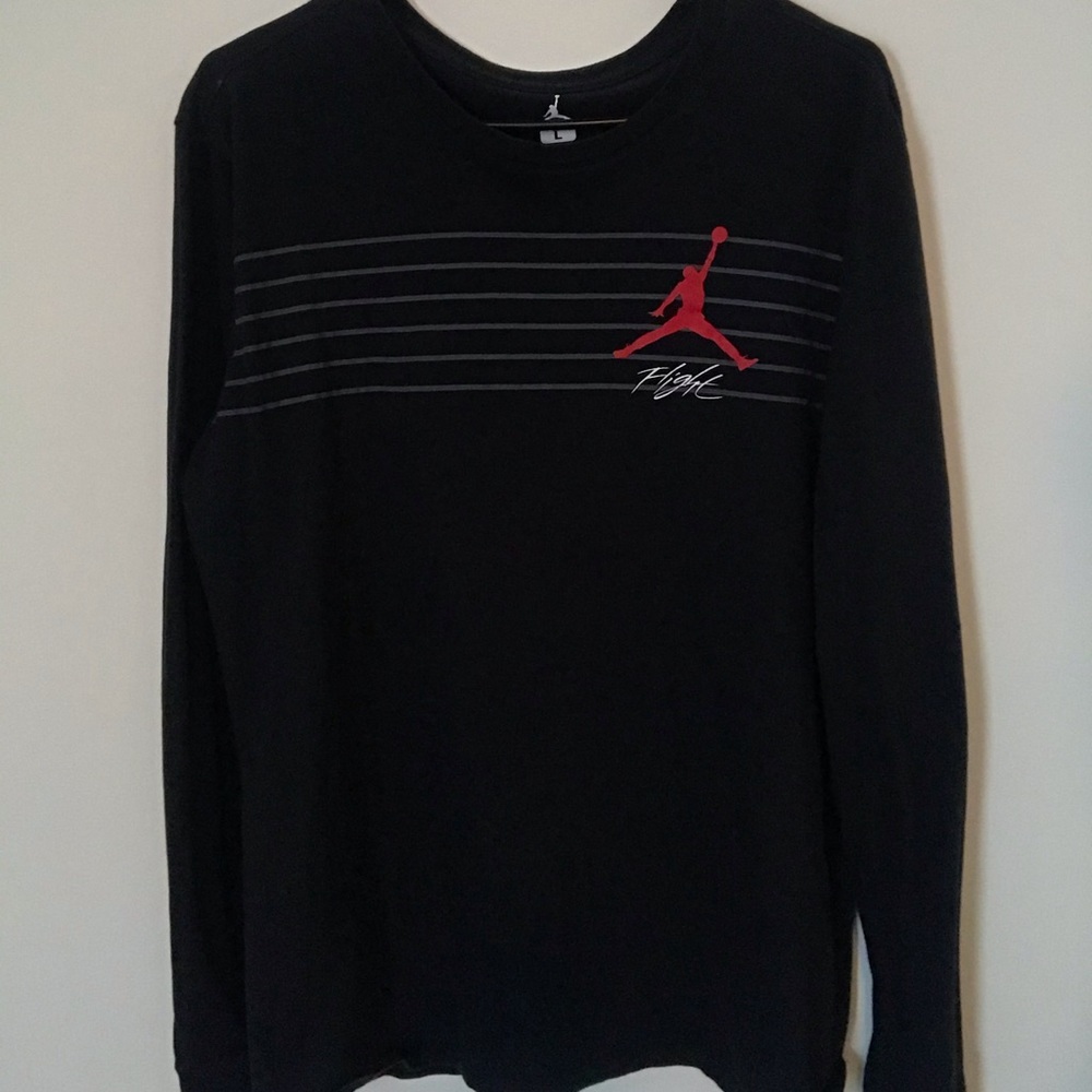 I’m selling a red and black Jordan Flight shirt.
